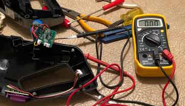 Digital multimeter, DMM in use testing some electronic equipment