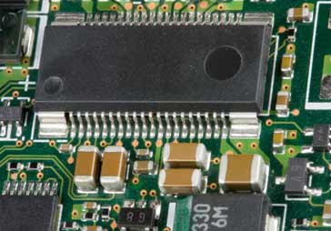 SMD capacitors and other SMT components on a printed circuit board